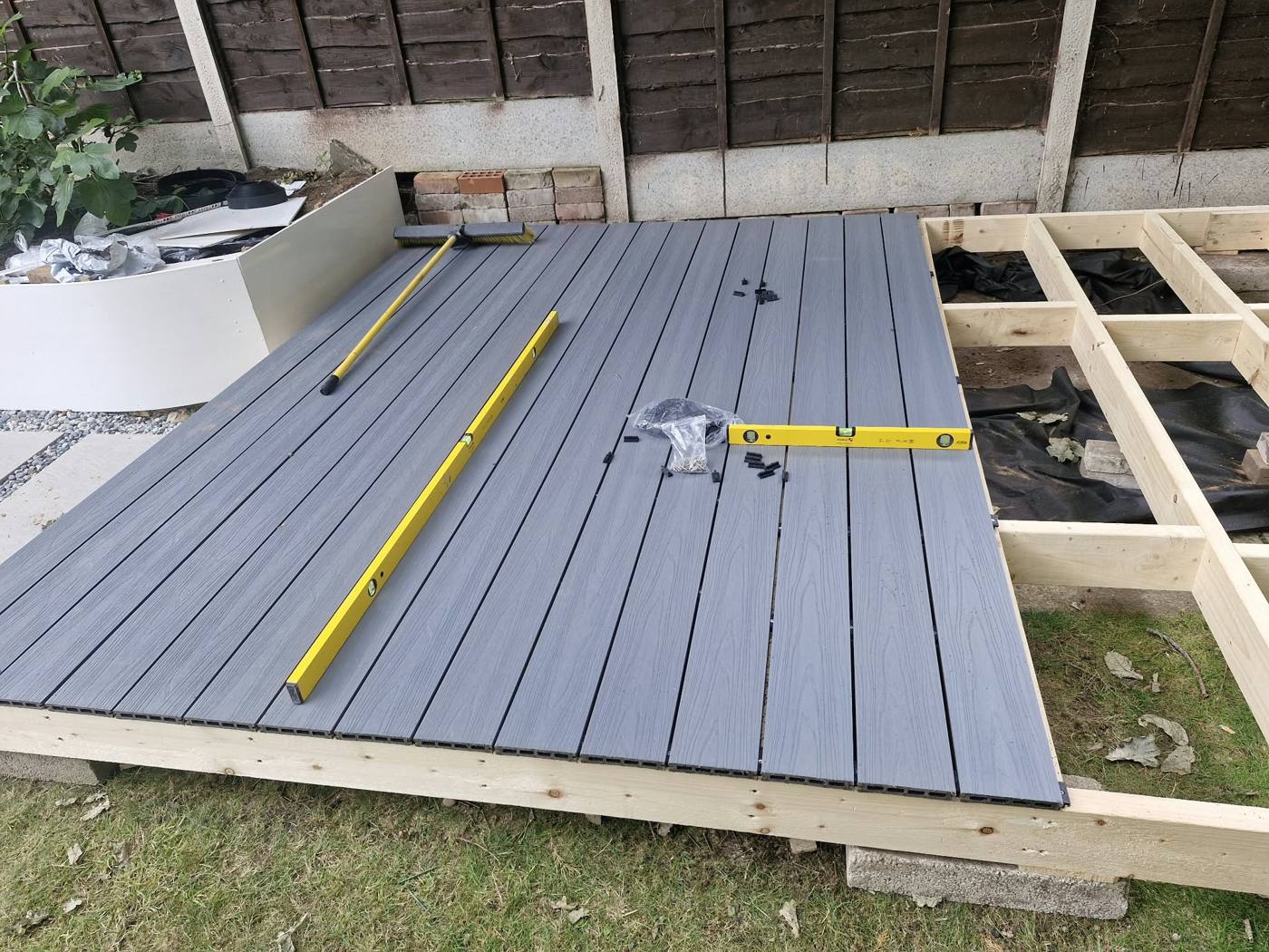 Composite boards half laid on the timber frame