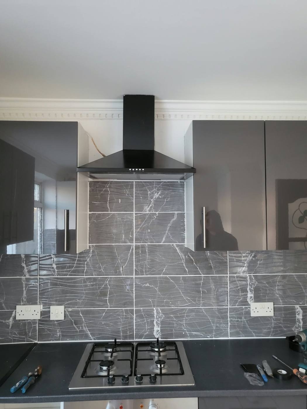 Finished kitchen with extractor hood over the hob
